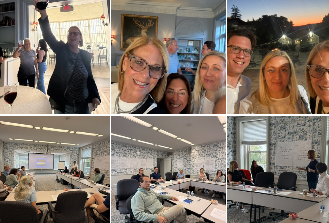 A group of people in an officeDescription automatically generated