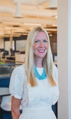 A person smiling at the cameraDescription automatically generated